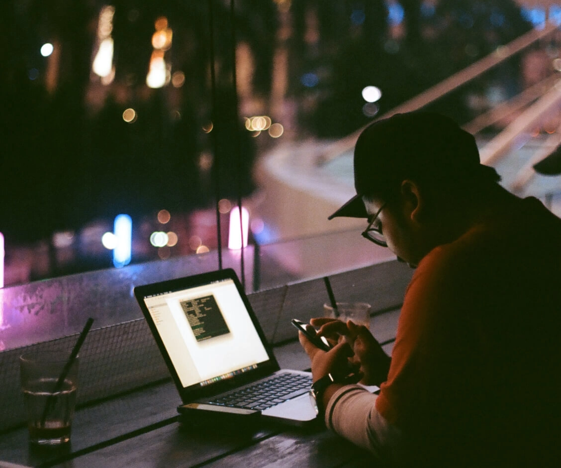 Person working on computer at night